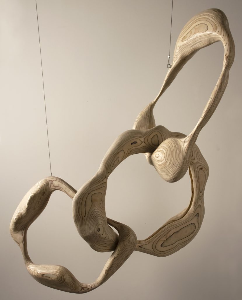 Handcrafted wood decor piece Flying Wheels by Dace Sūna