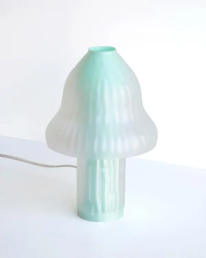 Lampamodelé Blue Table Lamp in gradient blue 3D printed PLA on a table, angled view.