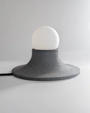 Basalte Table Lamp in black brown lava stone on table, front view